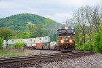 NS 7660 leads an eastbound intermodal downhill at Singer 